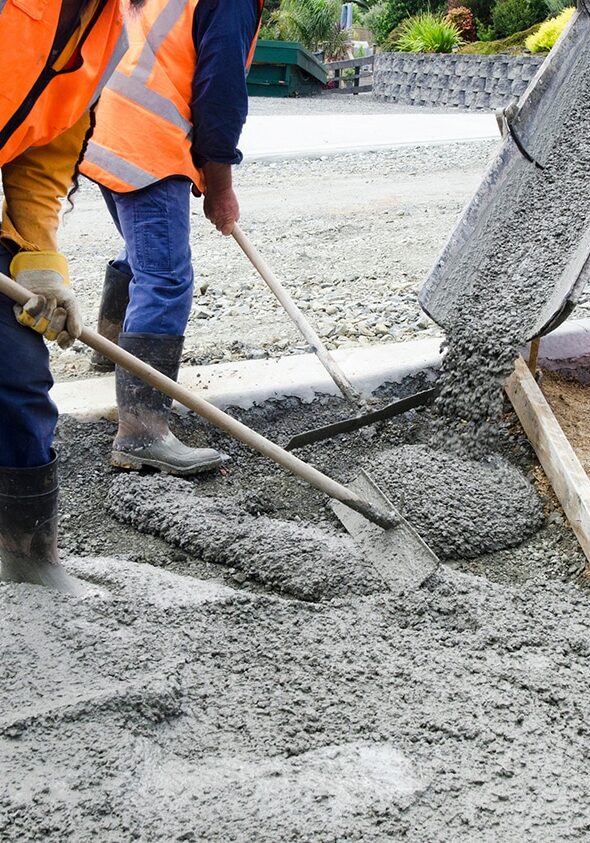 Builders pouring cement during Upgrade to residential street.